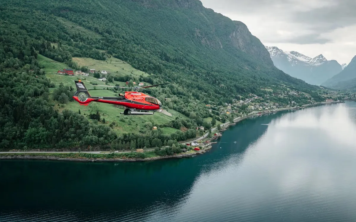 Helicopter over a fjord valley